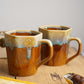 Brown and cream coffee mugs