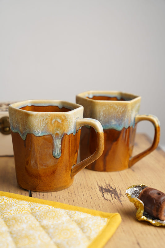 Brown and cream coffee mugs